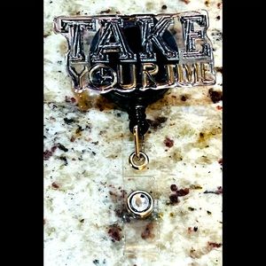 “Take your time,” badge reel. Badge pull.